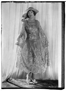 Dorothy Knapp wearing gold brocade over blue LCCN2014719062
