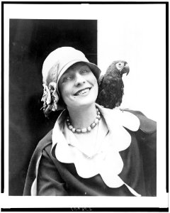 Dorothy Tierney, head-and-shoulders portrait, facing front, with her parrot on her shoulder LCCN92522657