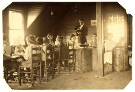 Dotheboys Hall in session tucked away upstairs over the store. Equipped with antique, dilapidated benches and chairs. The lessons begin at 6 A.M. and last for six hours, and these children LOC nclc.02907