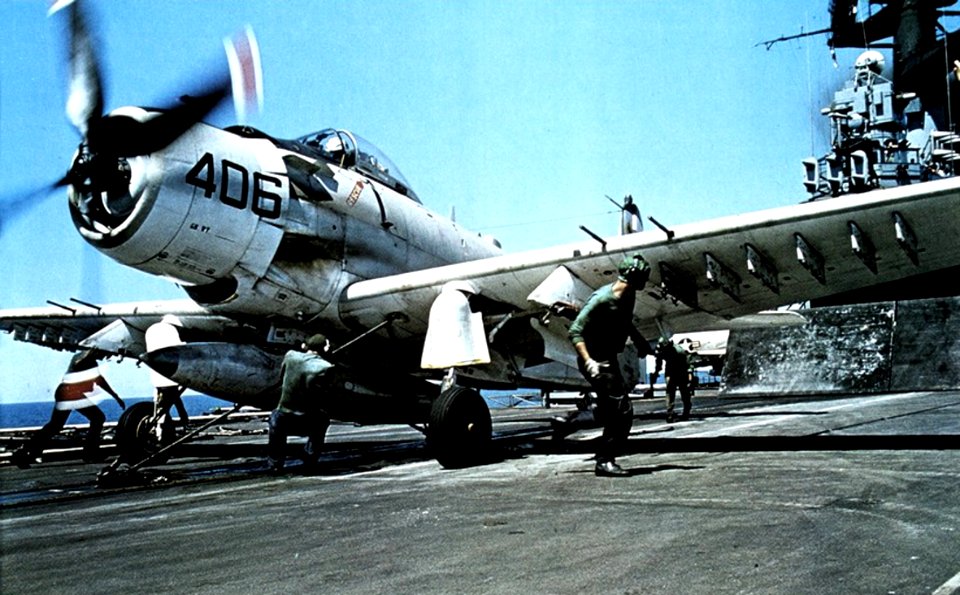 Douglas A-1H Skyraider of VA-25 is readied for launching from USS Coral Sea (CVA-43), circa in 1968