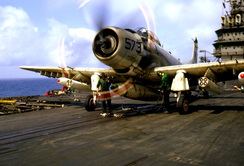 Douglas A-1H Skyraider of VA-25 is readied for launching from USS Coral Sea (CVA-43), circa in 1966