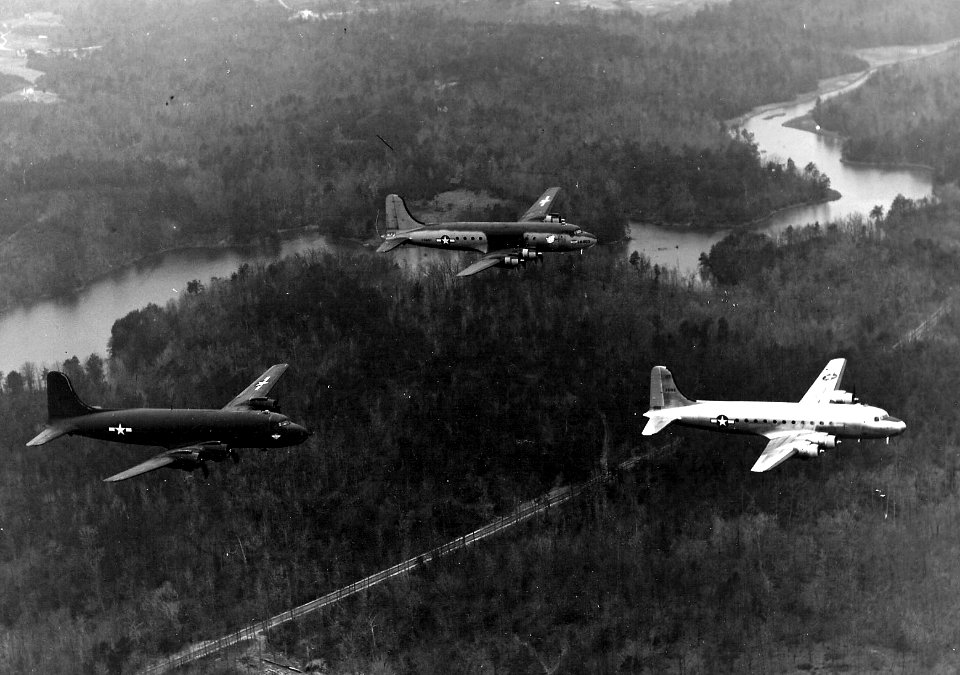 Douglas C-54s with different paint schemes over Florida c1945