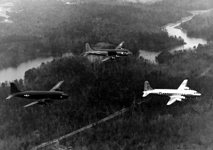 Douglas C-54s with different paint schemes over Florida c1945