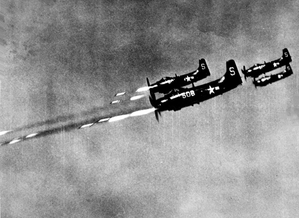 Douglas AD-4 Skyraiders of VA-55 firing rockets in Korea on 24 October 1950 (80-G-422387)