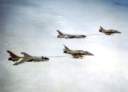 Douglas A-4F Skyhawks of VA-212 refuel Vought RF-8G Crusaders of VFP-63, circa in 1974 (6392048)