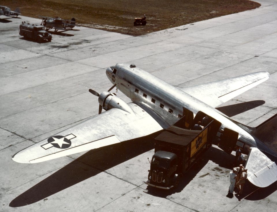 Douglas R4D-5 discharges high-priority freight in the United States, circa 1943-45 (80-G-K-13354)