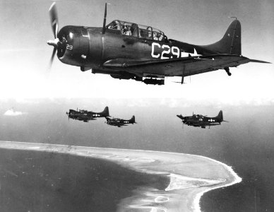 Douglas SBD-5 Dauntless of VC-35 fly over Eniwetok, 18 February 1944 (80-G-218609)