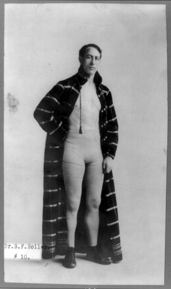 Dr. B.F. Roller, full-length portrait, standing, facing right, wearing boxing shorts and robe LCCN89706431