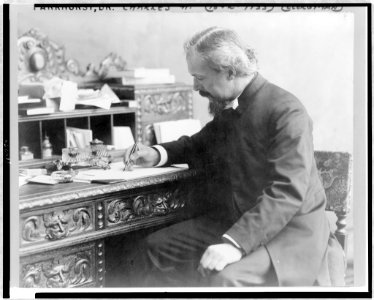Dr. Charles H. Parkhurst, three-quarter length portrait, seated at desk, with pen in hand, facing left LCCN97506827