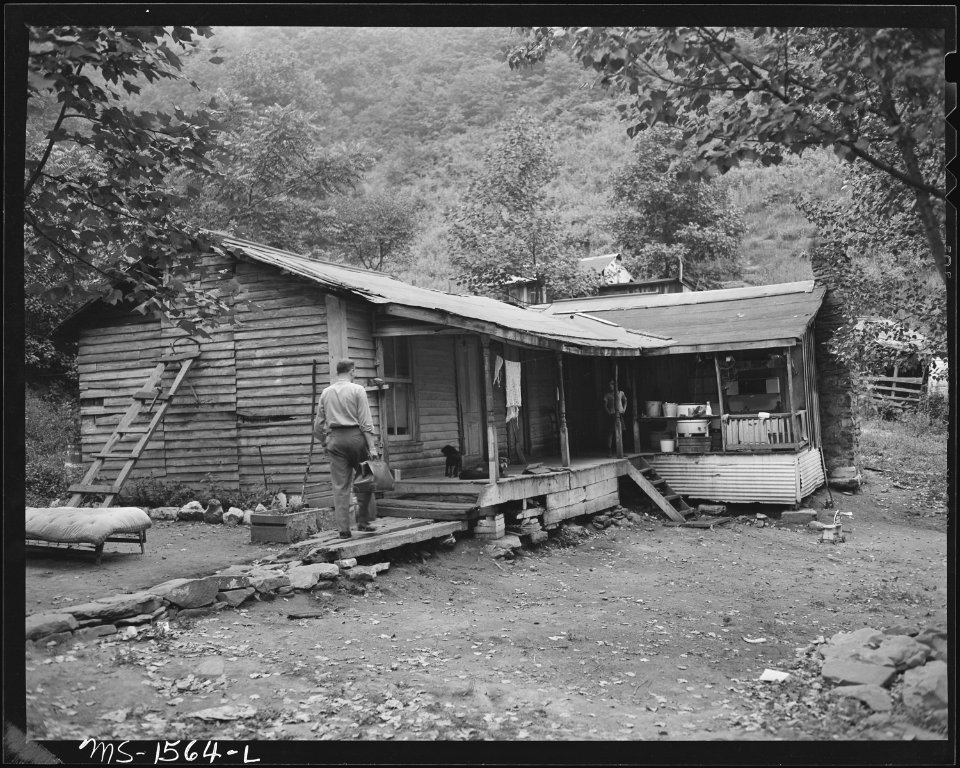 Dr. R. V. Tokar, company doctor, making house call. This house in privately owned and is built on company-owned land... - NARA - 540857