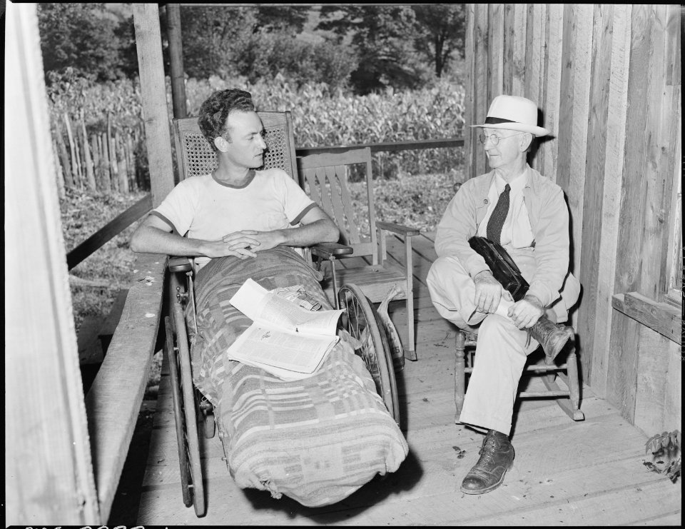 Dr. Pierce Martin visits Ed La Rossett whose back was broken five years ago in a slate fall. Kentucky Straight Creek... - NARA - 541251