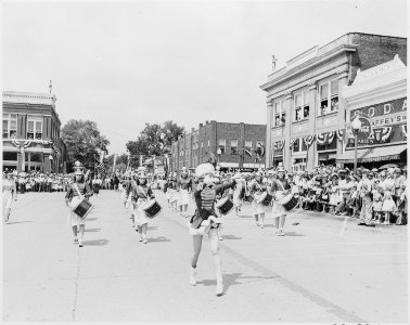 Drum majors, probably from Bolivar High School, passing before the reviewing platform (not visible) on which Harry S.... - NARA - 199903