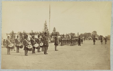 Drum corps stands in front of Union soldiers in formation LCCN2012649354