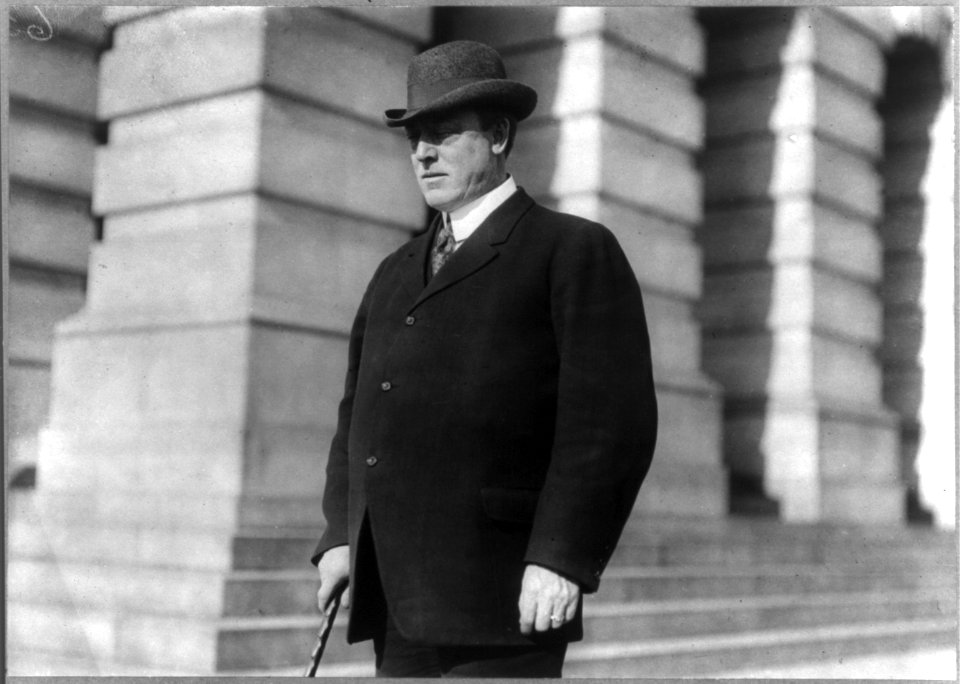 Duncan E. McKinlay, 1862-1914, half length portrait, facing left, standing outside of building. Cong., Calif. LCCN2006677866