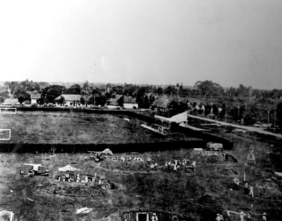 Dutch prisoners working on emplacements of 75mm anti-aircraft battery near Surabaya, Java, 9 September 1943