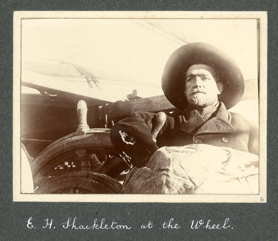 E H Shackleton at the wheel of Discovery (1901) RMG F6218