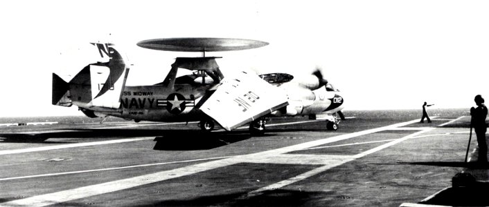E-2B Hawkeye of VAW-115 folding wings on USS Midway (CVA-41) in 1971