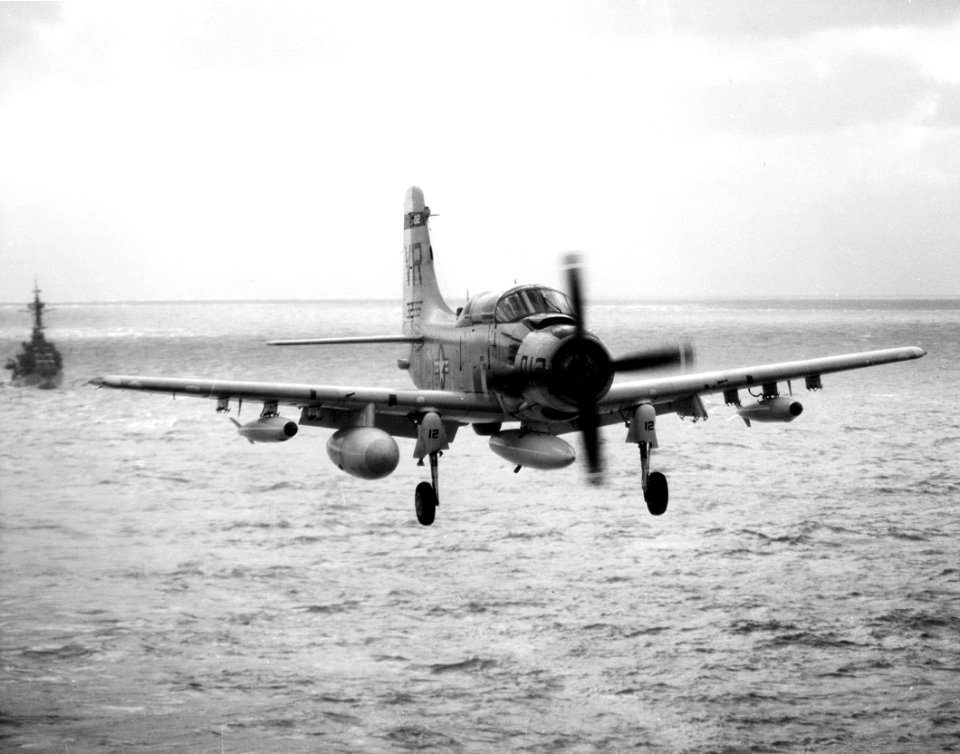 EA-1F Skyraider of VAW-13 Det.63 of approaches USS Kitty Hawk (CVA-63), circa in 1968 (NNAM.1996.253.2285)