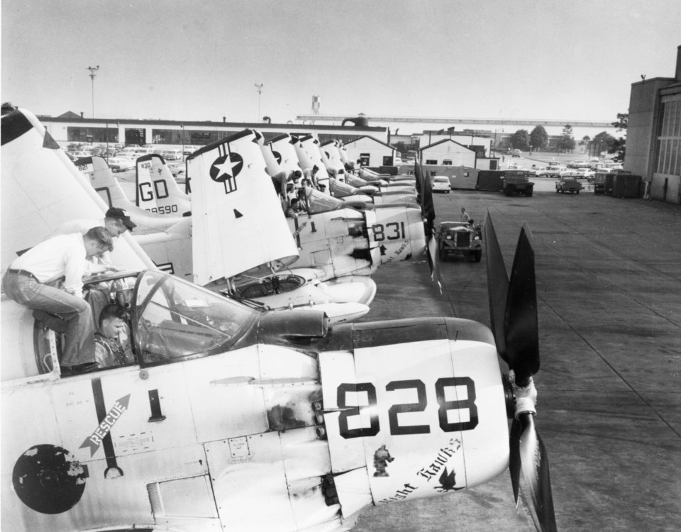 EA-1 Skyraiders of VAW-33 are readied for flight at NAS Quonset Point in July 1963