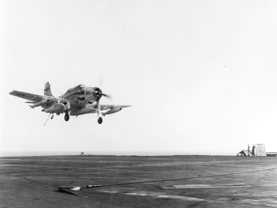 EA-1F of VAW-33 landing on USS America (CVA-66) c1965