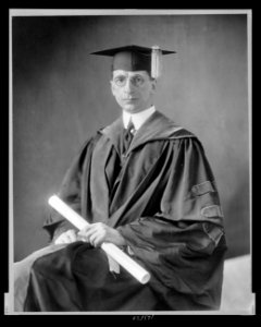 Eamon De Valera, three-quarter length portrait, seated, facing front, wearing cap and gown LCCN99471564