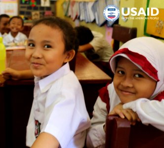 Early graders in USAID partner schools read illustrated books to help them understand what they read. (33970972634)