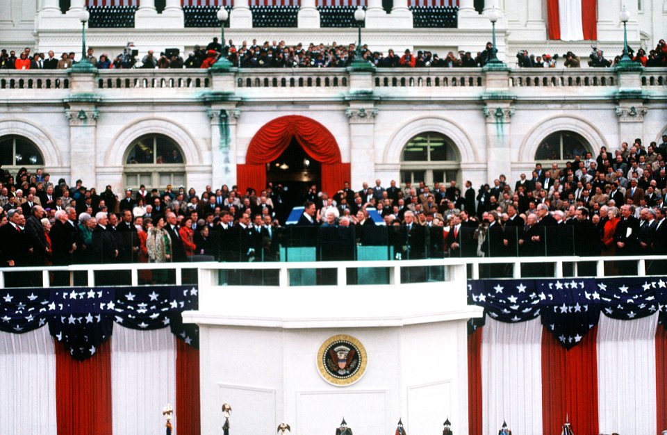 George H. W. Bush is sworn in as the 41st President of the United States by Chief Justice William H. Rehnquist as Barbara Bush looks on