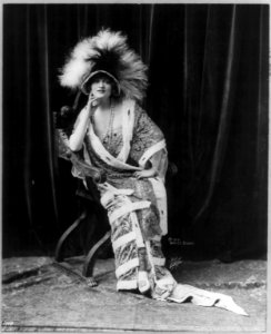 Gaby Deslys, 1884-1920, full length, seated, facing slightly left, wearing feathered hat LCCN2005693307