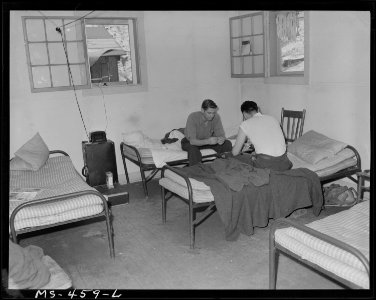 Game of cards in bachelor quarters for miners in company housing project. Utah Fuel Company, Sunnyside Mine... - NARA - 540424 photo