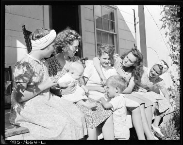 Gathering of women and children in front porch of miners home. Koppers Coal Divison, Kopperston Mine, Kopperston... - NARA - 540894