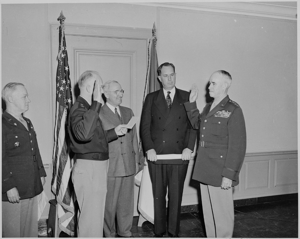 Gen. Dwight Eisenhower swears in Gen. Omar Bradley (right) as Chief of Staff of the U. S. Army in a ceremony at the... - NARA - 199632