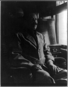 Gen. Francisco Villa, three quarter length portrait, seated in a railroad car LCCN2016651809
