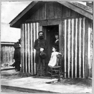 General John Aaron Rawlins, 1831-1869, full length, standing at door, with wife and child LCCN2006691865