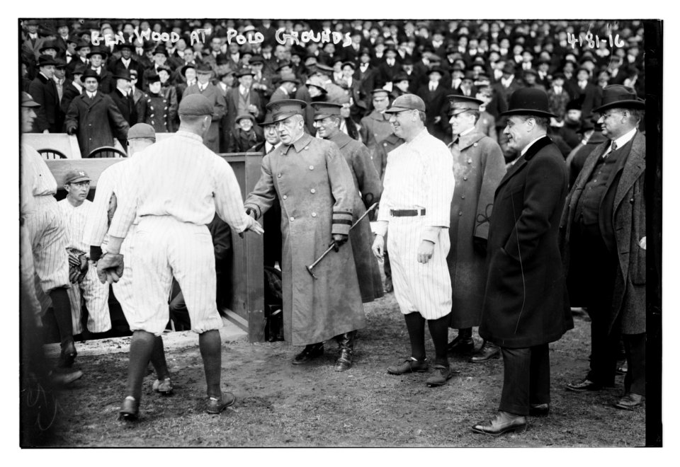 General Leonard Wood shakes hands with a Yankee baseball player as Yankees Manager Bill Donovan stands to the right of him, Polo Grounds, New York (baseball) LCCN2014704383