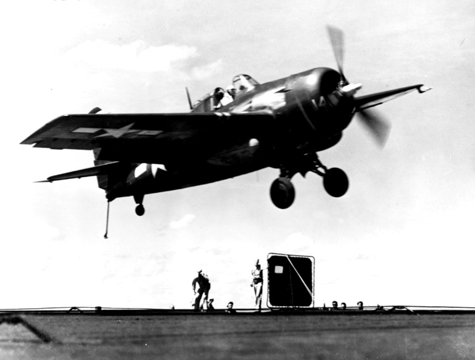 General Motors FM-2 Wildcat in flight over USS Makin Island (CVE-93), circa in 1945 (NH 94875)