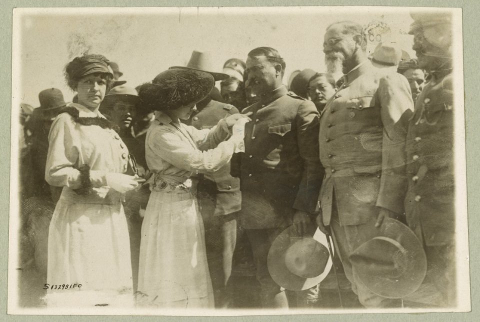 General Obregon receiving medal from admirers in Celaya, Mexico Mexican-U.S. campaign after Villa, 1916. LCCN2013645869