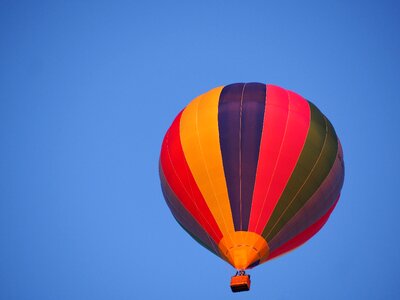 Flying hot air balloon ride blue photo