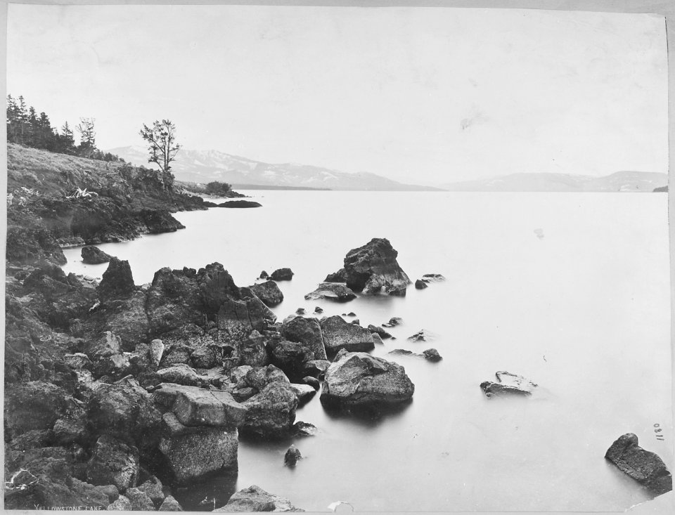 East shore of Yellowstone Lake showing the valley of the upper Yellowstone River. Yellowstone National Park. - NARA - 517623
