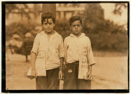 Eddie and Carmine Zizza, twelve year old twins who make $1.50 a day. They belong to a family of 13 children many of them newsboys. Newark, N.J. - August 1st, 1924. LOC nclc.04051