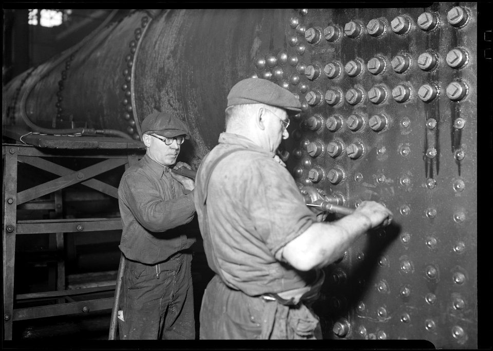 Eddystone, Pennsylvania - Railroad parts. Baldwin Locomotive Works. Boilermaker and helper working on locomotive boiler. - NARA - 518706