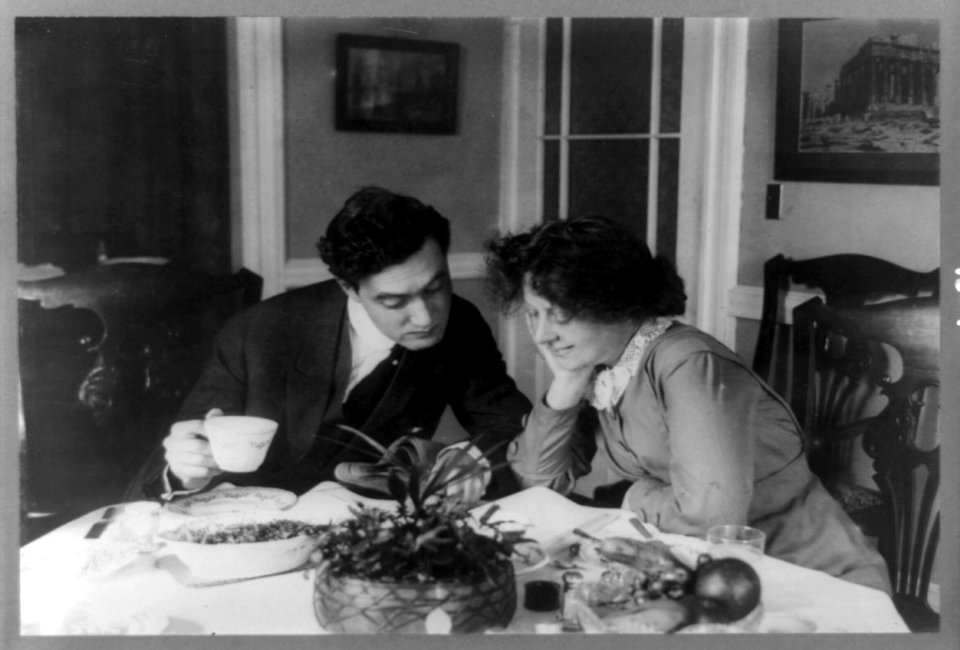 Edgar Selwyn and Margaret Mayo Selwyn seated at table reading together LCCN90705774