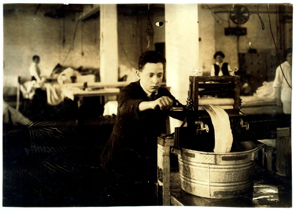 Edward McGurin, 14 years old. Wringing curtains at Boutwell, Fairclough & Gold, 274 Summer Street Extension. Mr. Fitzgerald, Manager. LOC nclc.05187