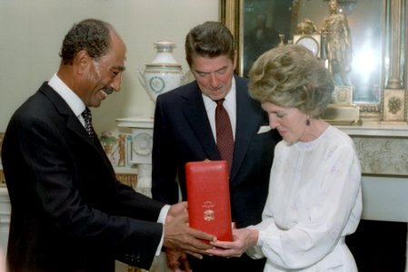 Egyptian President Anwar Sadat Presents a Gift Collar of The Nile to President Ronald Reagan and Nancy Reagan in The Blue Room