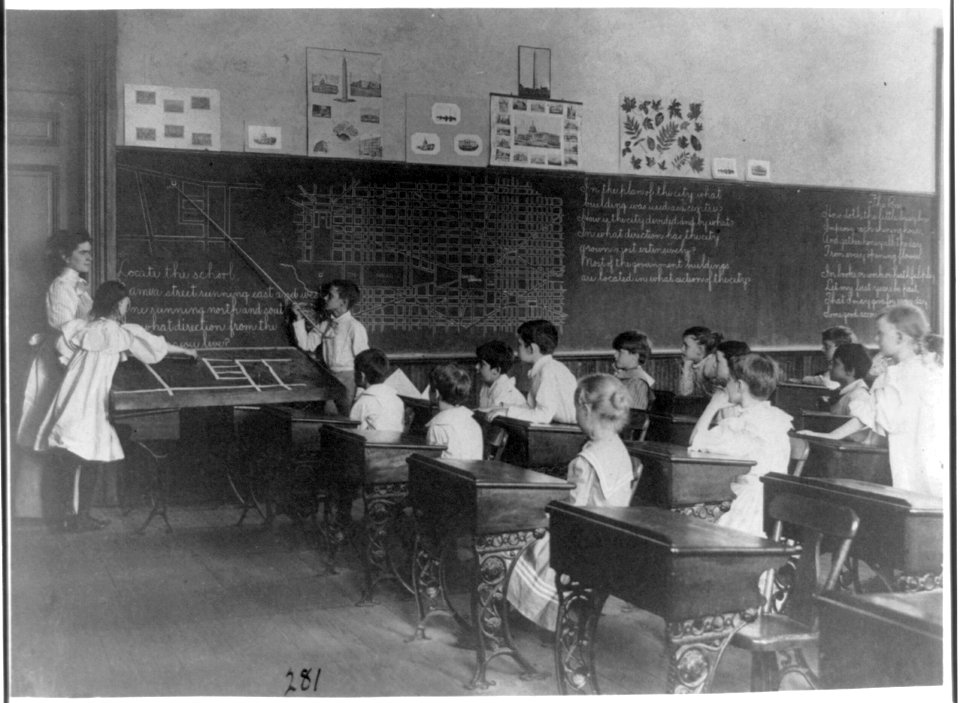 Elementary school children studying map of city, Washington, D.C. LCCN2001703655