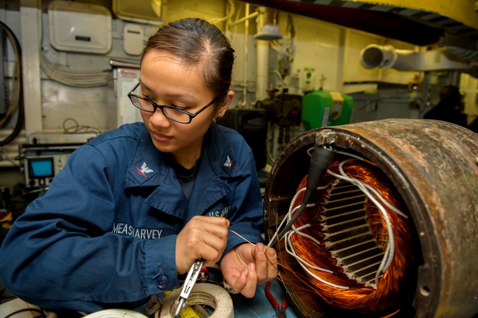 Electrician's Mate 3rd Class Melody Measharvey rewires a main feed booster pump
