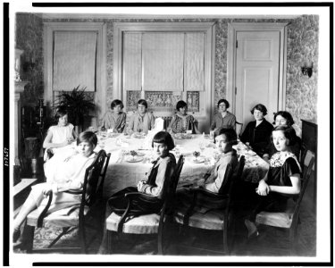 Eleven girls seated around dining room table, probably a birthday party held in Washington, D.C. LCCN93507053
