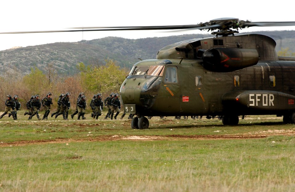 German CH-53 Helicopter assigned to the Stabilization Force and Portuguese Army Soldiers