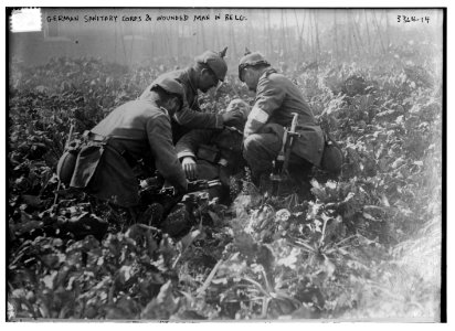 German Sanitary Corps & wounded man in Belg. (i.e., Belgium) LCCN2014698111