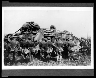 German soldiers standing around a German tank as other soldiers work on the tank LCCN2005697183 photo