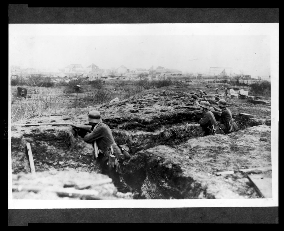 German soldiers in a trench; in background, a town LCCN2005697186